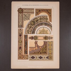 May include: An antique print from "Le Journal de la Decoration" featuring architectural design elements. The print showcases ornate patterns in beige, brown, green, and gold, with text at the top and bottom. The design includes arches, borders, and decorative motifs.