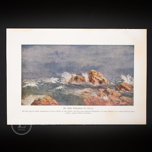 May include: Vintage print of a seascape showing waves breaking on rocks under a cloudy sky. The artwork uses a muted colour palette with blues, browns, and white. German text is visible at the bottom of the print.
