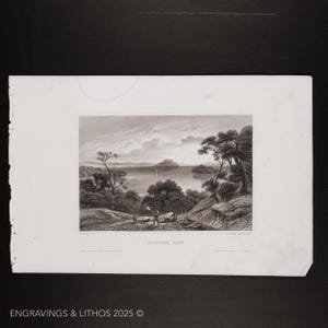 May include: A black and white engraving of a lake scene with trees and a small boat in the distance. The title "KATATAK LAKE" is printed below the image.