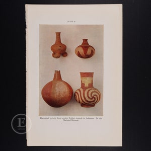 May include: Four pieces of decorated pottery from ancient Indian mounds in Arkansas. The pottery is red and white with geometric designs. The image is from the National Museum.