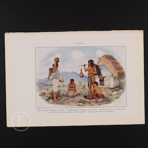 May include: A watercolor painting depicting a group of people from the Igorot tribe in the Philippines. The painting shows a group of people in traditional clothing, with a woman carrying a child on her back. The painting is set in a mountainous landscape, with a small hut in the background. The caption below the painting reads: "Igorot group, Philippine Islands. The Philippine aborigines never had a true Bronze Age, but learned the use of iron from Asia within recent centuries. Group in the National Museum."