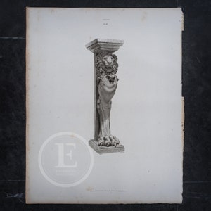 May include: A black and white engraving of a stone column with a lion's head and paw at the top. The column is on a white background. The engraving is from the book "Sculptures Decoratives" by the French architect and designer, Charles Percier.