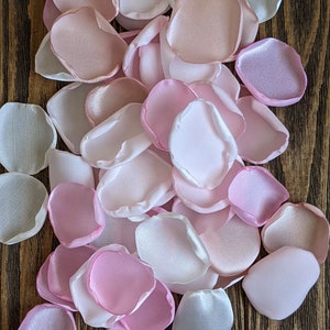 Blush and pink mixture of rose petals for wedding decor