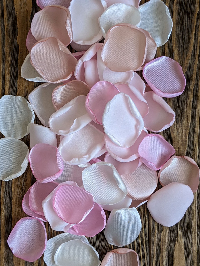 Blush and pink mixture of rose petals for wedding decor