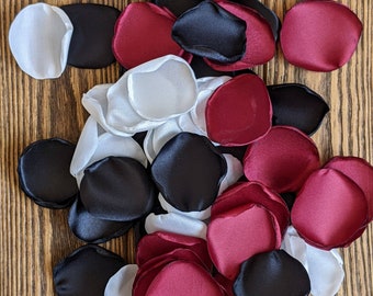 Black and red rose petals for modern boho barn wedding decor-dinner table floristry idea for aisle runner and altar-moody fall decorations