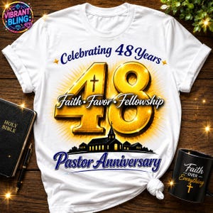 May include: White t-shirt with a gold and blue design celebrating a 48-year Pastor Anniversary. The design includes the words "Celebrating 48 Years", "Faith Favor Fellowship", and "Pastor Anniversary". A black mug with the words "Faith Over Everything" is also visible.