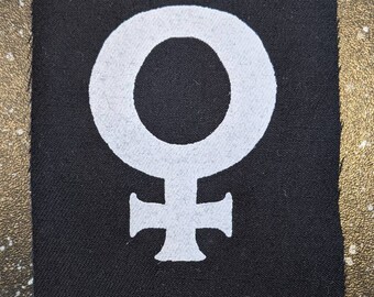 Parche de tela con el símbolo de Venus femenina