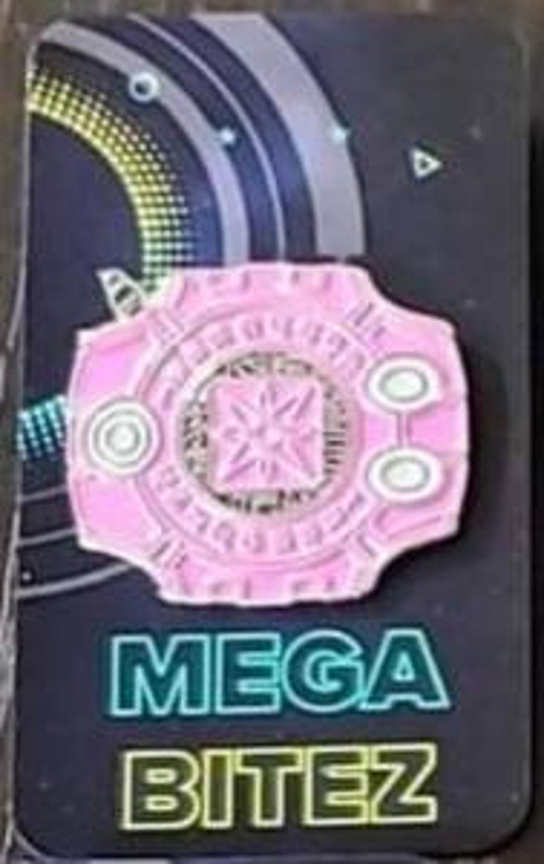 May include: Pink enamel pin with a white outline and a silver star in the center. The pin features the text "MEGA BITEZ" in white letters below the design.