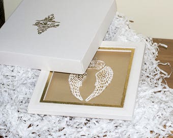 White gift box with handmade golden logo