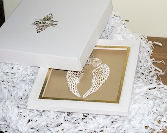 White gift box with handmade golden logo