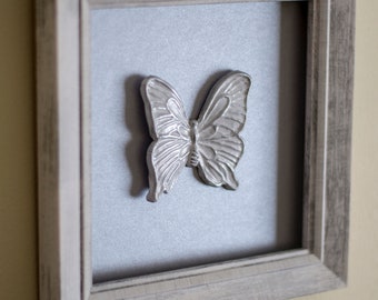 Gray framed silver butterfly wall decor