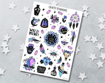 May include: A sticker sheet titled Crafty Planning featuring various illustrations including a dreamcatcher, crystals, a unicorn, a skull, a hamsa hand, and bottles. Text includes Wild Mind, I Love You, You Are The Best, Magic Love, and Magic.