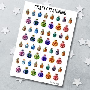 May include: A white sticker sheet titled CRAFTY PLANNING featuring rows of small, colourful potion bottle stickers. Each bottle contains various coloured glitter shapes like stars and circles, with cork stoppers. The code WTC-001 is printed at the bottom.