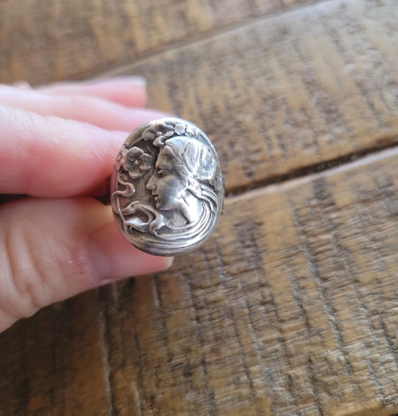Nouveau woman ring. Sterling silver woman and flower ring.