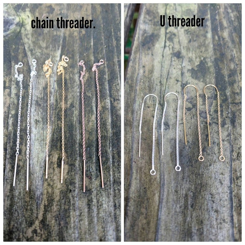 May include: Two types of earring findings, chain threader and U threader, in silver, gold, and rose gold. The chain threader is a long chain with a small loop at the top and a straight wire at the bottom. The U threader is a U-shaped wire with a small loop at the top and a chain attached to the bottom.