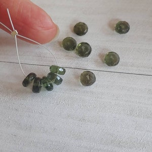 Authentic moldavite rondelle faceted beads. Tektite beads. 3x7mm beads. This listing is for 5 beads