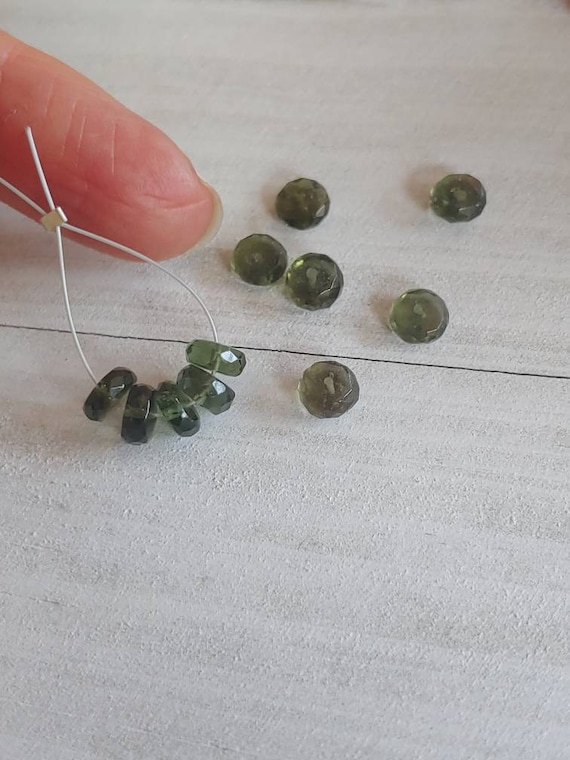 Authentic moldavite rondelle faceted beads. Tektite beads. 3x7mm beads. This listing is for 5 beads