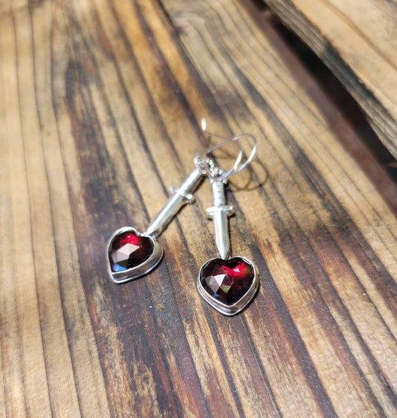Garnet heart and dagger earrings. Sterling silver heart earrings. Knive through heart. Love hurts. Unique love earrings