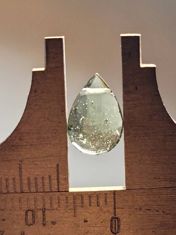 1 single moldavite briolette gemstone.  Authentic moldavite