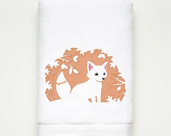 May include: White embroidered fox in a brown leafy design on a white towel.