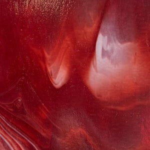 May include: Abstract close-up of a textured surface with swirling patterns in shades of red and white. The glossy finish reflects light, creating a dynamic visual effect. The design evokes a sense of movement and depth.