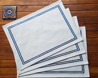 White cotton placemats embroidered with a blue border - set of 4