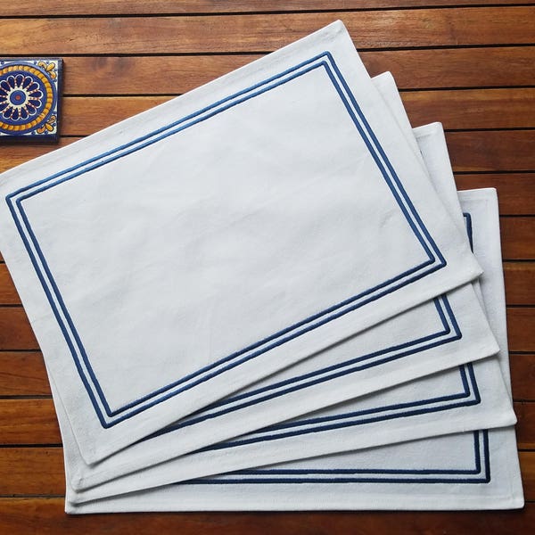 White cotton placemats embroidered with a blue border - set of 4