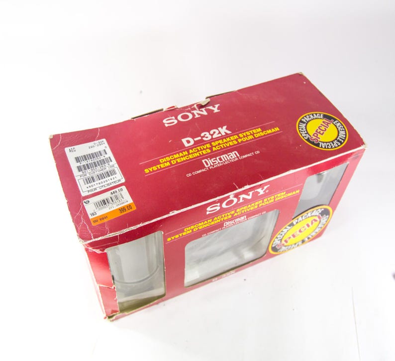 May include: A red box with the words "SONY" and "D-32K" printed on it. The box is for a Discman active speaker system. The box has a special package offer.