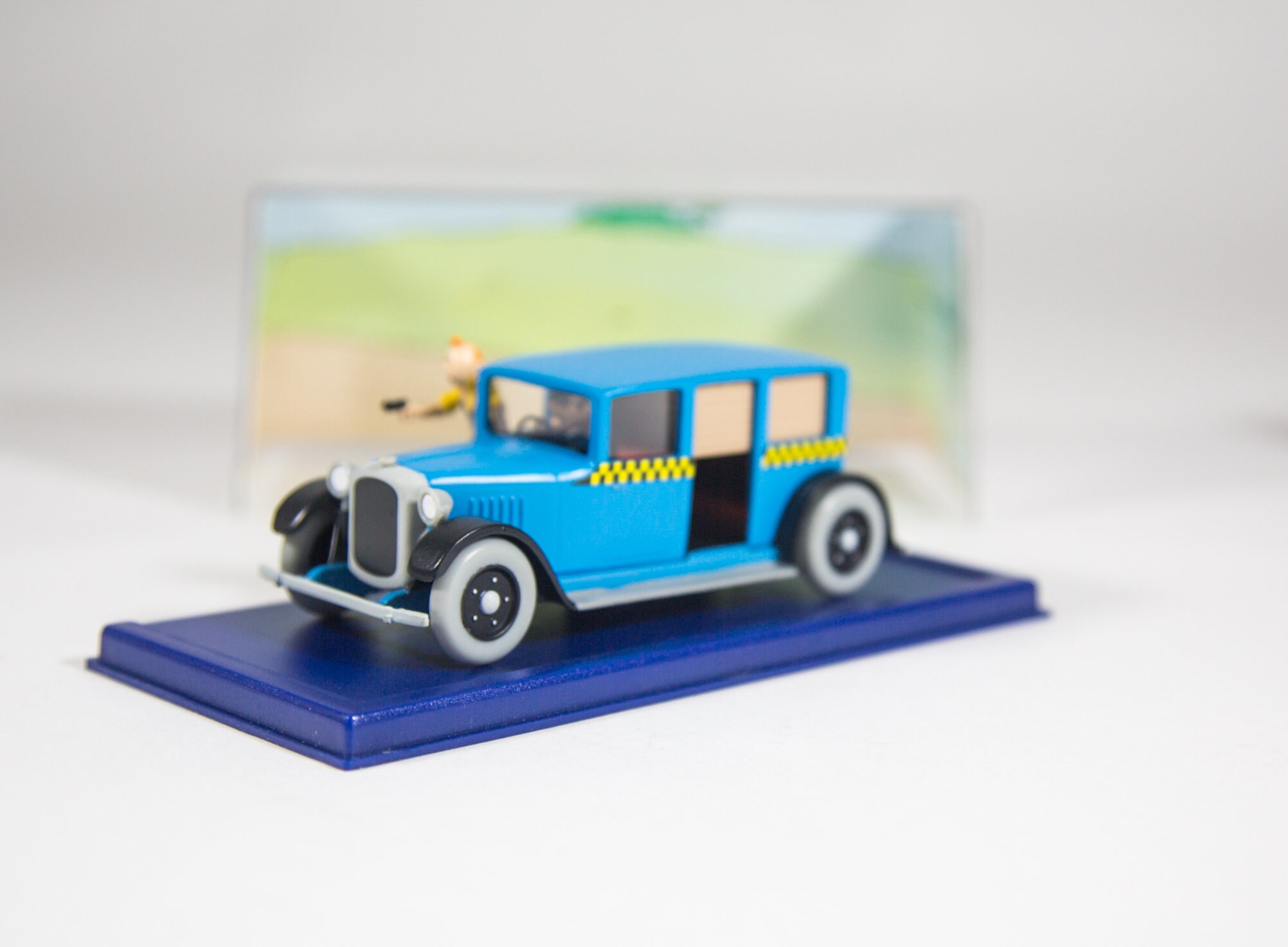 TinTin ミニカー　1/43 Taxi Checker LIMITED EDITION: Taxi Checker (1/12 Scale) – THE TINTIN SHOP SINGAPORE