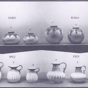 May include: A collection of ceramic vases and pitchers in various sizes and styles. The vases are decorated with intricate patterns and designs. The pitchers have a fluted design and are perfect for serving beverages.