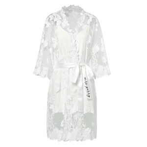 These are our Full Lace detail bridal robes, they are stunning and ideal to add to your bridal party for your big day.
These are beautiful and make  stunning bridal robe, and come personalised with yout new married name on the belt.

White lace robe for the bride and tropical print for the bridal party!