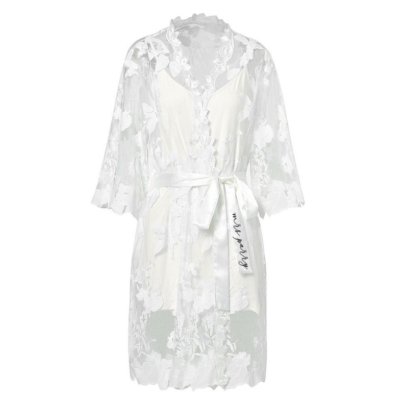 These are our Full Lace detail bridal robes, they are stunning and ideal to add to your bridal party for your big day.
These are beautiful and make  stunning bridal robe, and come personalised with yout new married name on the belt.

White lace robe for the bride and tropical print for the bridal party!