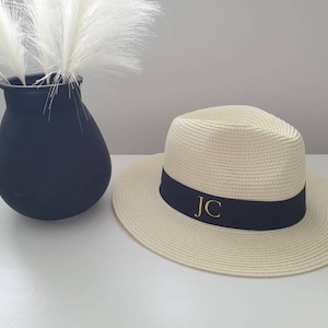 Personalised Beach Hat with initials printed on the front. These straw hats are ideal for a holiday or honeymoon. Matching his and hers fedora straw hats.