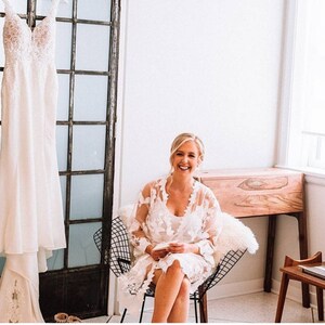 These are our Full Lace detail bridal robes, they are stunning and ideal to add to your bridal party for your big day.
These are beautiful and make  stunning bridal robe, and come personalised with yout new married name on the belt.

White lace robe for the bride and tropical print for the bridal party!