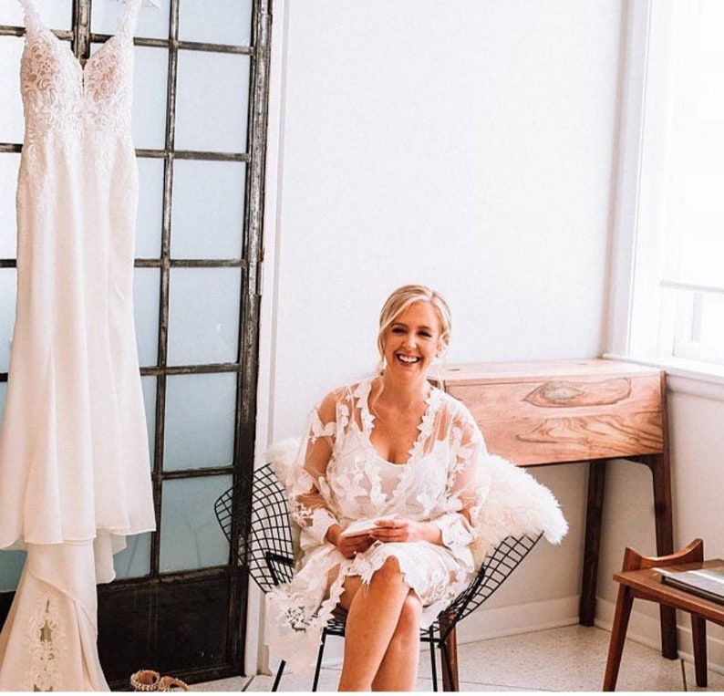 These are our Full Lace detail bridal robes, they are stunning and ideal to add to your bridal party for your big day.
These are beautiful and make  stunning bridal robe, and come personalised with yout new married name on the belt.

White lace robe for the bride and tropical print for the bridal party!