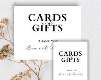 May include: Two white signs with black text that reads "CARDS and GIFTS" and "THANK YOU Ben and Heather".