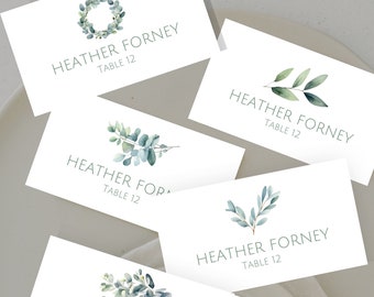 May include: Four place cards with a watercolor eucalyptus design. Each card reads "Heather Forney, Table 12".