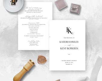 May include: Elegant wedding stationery set featuring a ceremony program, invitation, and details card. Includes a ring box, a small dish with a portrait, and a wax seal. The invitation reads "The Wedding of Kateri Hawley and Kent Roberts."