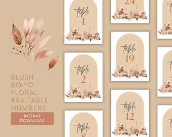 May include: Set of ten blush pink and brown floral table number cards with a modern arch design. The numbers 1, 2, 8, 12, 19, and 24 are visible.  The text "table" is written in a cursive font.