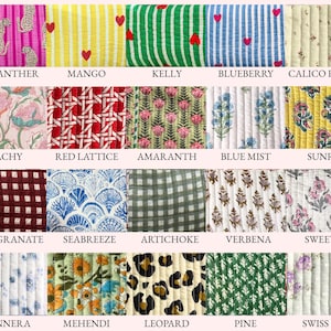 May include: A collection of quilted fabric swatches with various patterns and colors. Designs include pink leopard print, yellow with red hearts, green stripes, blue stripes, floral, and geometric patterns. Each swatch has a name printed below it.
