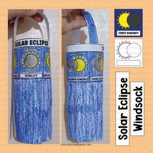 May include: A blue and white paper craft solar eclipse windsock. The windsock has a handle and four sections showing the different stages of a solar eclipse. The text "SOLAR ECLIPSE" is printed at the top of the windsock. The text "FIRST CONTACT" is printed below a black and white illustration of the sun and moon.