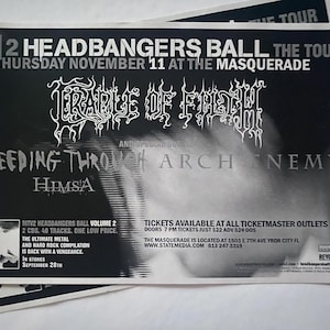 May include: Black and white promotional poster for the "2 Headbangers Ball" tour featuring Cradle of Filth, Bleeding Through, Arch Enemy, and HIMSA. The poster includes event details, date, venue, and ticket information.