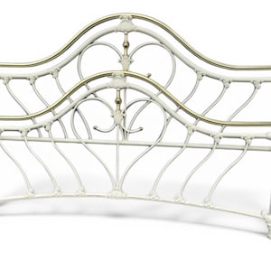 May include: A cream-colored metal headboard featuring a curved frame with decorative scrollwork and polished brass-toned accents on the top rails and finials. The structure includes vertical bars and ornate detailing at the joints.
