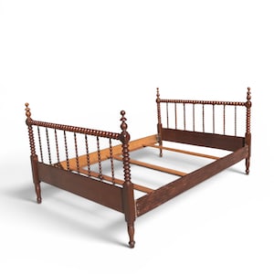 May include: A dark brown wooden bed frame with a spindle headboard and footboard. The bed frame has turned posts and a slatted base. The bed frame is made of wood and has a classic design.