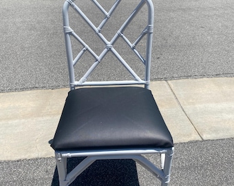 Vintage Chinese Chippendale Style White Stacking Rattan Chair with upholstered black vinyl seat ( 12 available- sold individually)