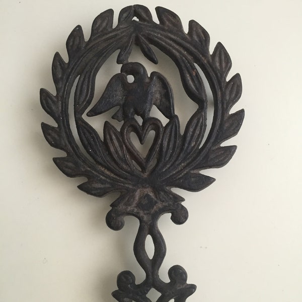 Vintage Black Cast Iron Trivet, pot holder, cookware holder, Eagle and heart design. Americana