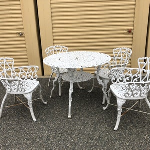 Vintage Victorian Cast Aluminum Patio Dining Set includes 4 arm chairs  and dining table