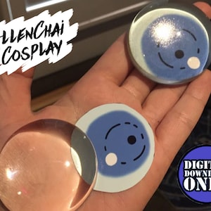May include: Three round, clear, glass-like objects with a blue and white design. The design features a circle with a black dot and a white dot inside. The text "DIGITAL DOWNLOAD ONLY" is visible in the lower right corner of the image.