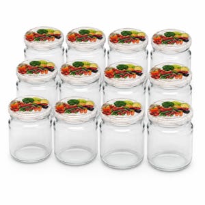 May include: A set of twelve clear glass jars arranged in a grid. Each jar features a white lid decorated with a colourful printed pattern of various fresh vegetables, including broccoli, carrots, tomatoes, and peppers, providing a uniform look.