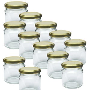 May include: A selection of clear glass jars, each with a gold-coloured lid. The jars are cylindrical with a wide opening and a screw-on lid. Ideal for preserving or storing items. Each jar is approximately 8 cm tall.